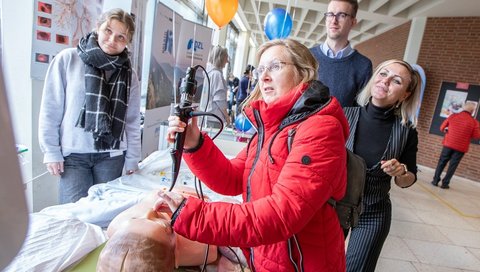 A woman tests a bronchoscopy on a demonstration dummy at the open day. 