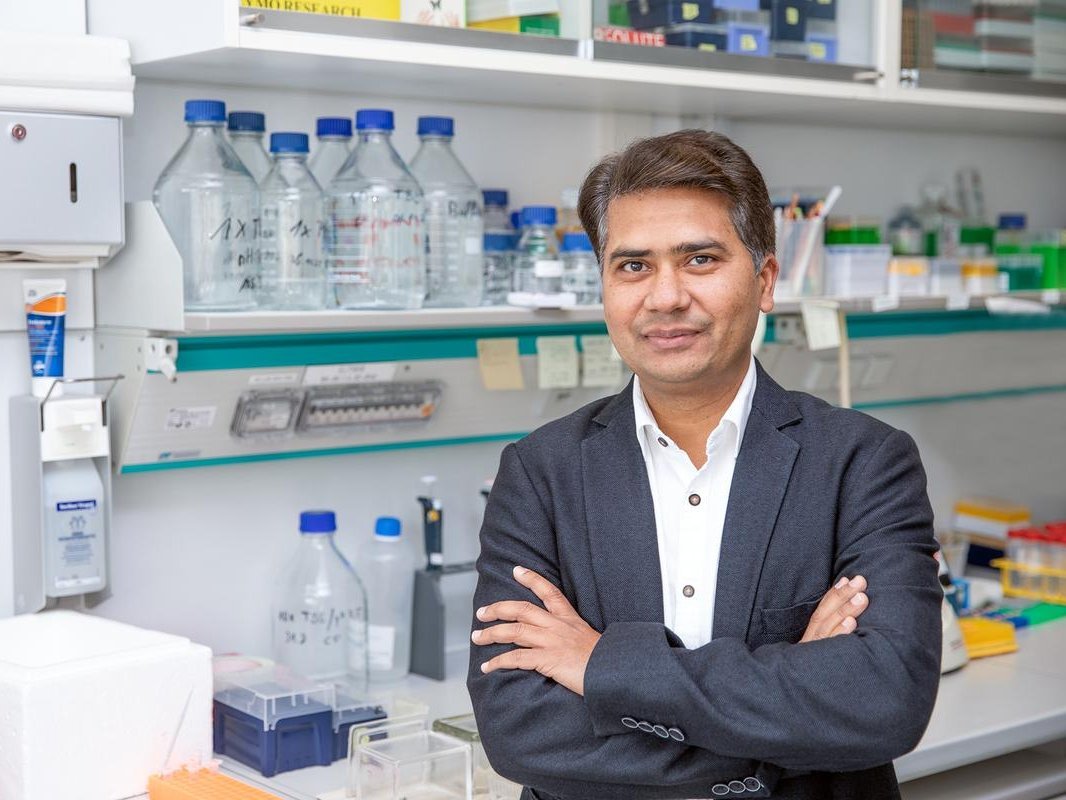 A man standing in a research laboratory.
