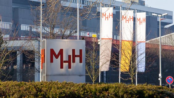 Flags and stele at the main entrance to the MHH-Campus