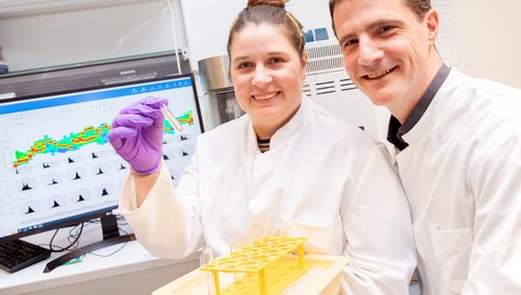 Sophie Anna Engelskircher and Dr Norman Woller are in the lab looking into the camera