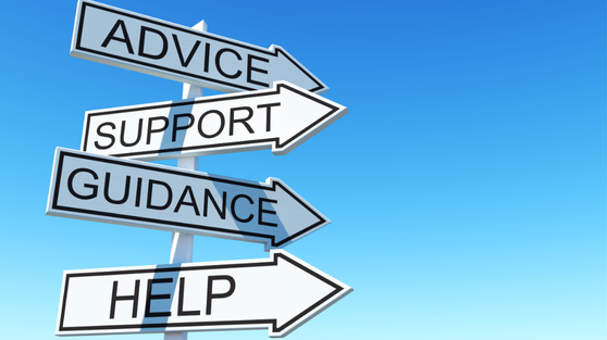 A pole which has four signs on it, they read: "Advice", "support", "guidance" and "help".