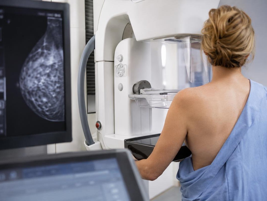 Ms. Smith at a mammography machine.