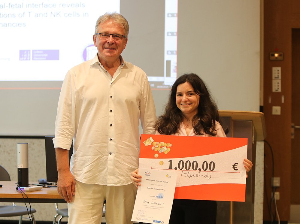 Student receives cheque from speaker of the program