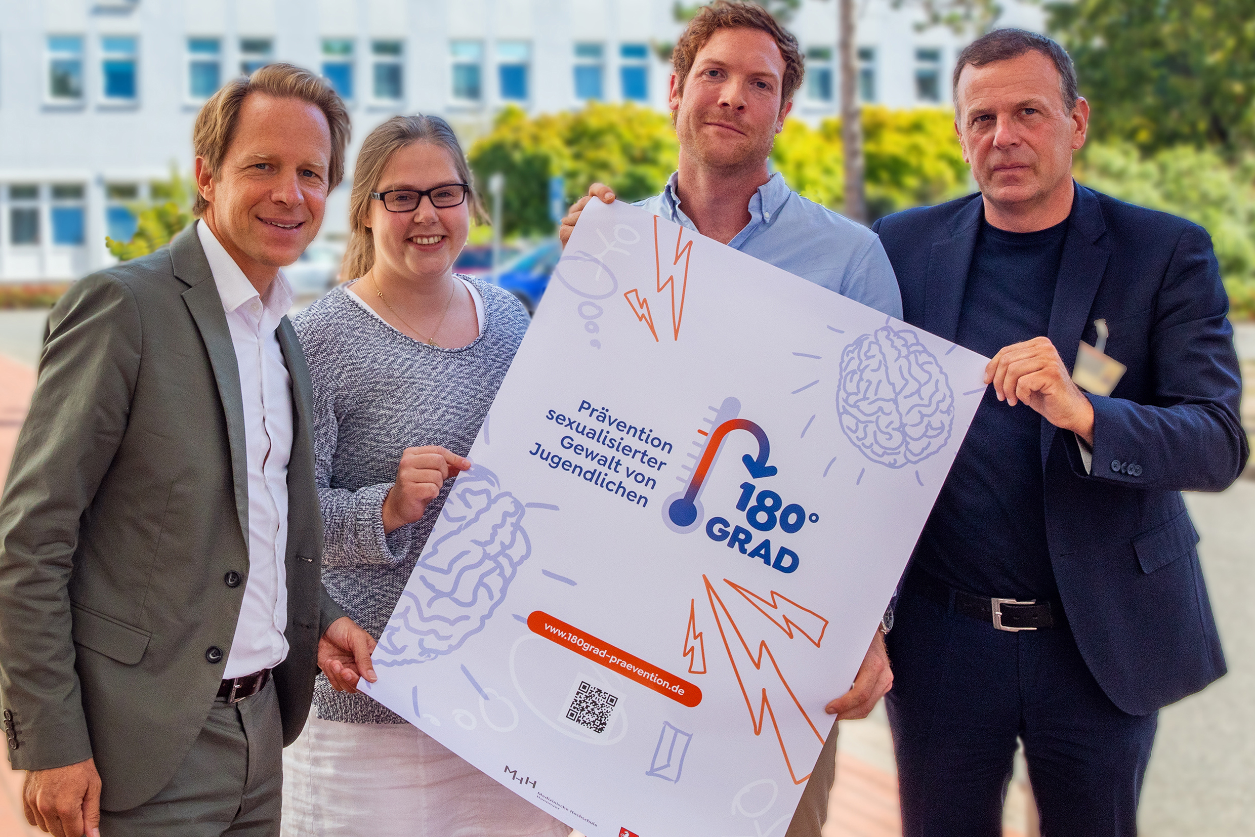 Professor Dr Tillmann Krüger, Theresa Engelmann, Dr Jonas Kneer and Clinic Director Professor Dr Stefan Bleich look at the promotional poster for the new outpatient clinic "180Grad"