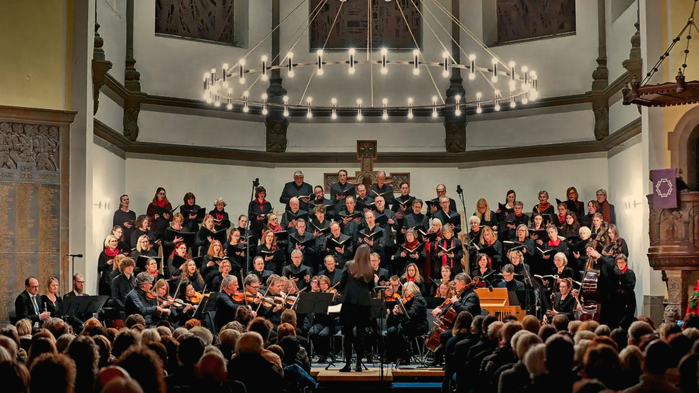 an orchestra plays in front of people