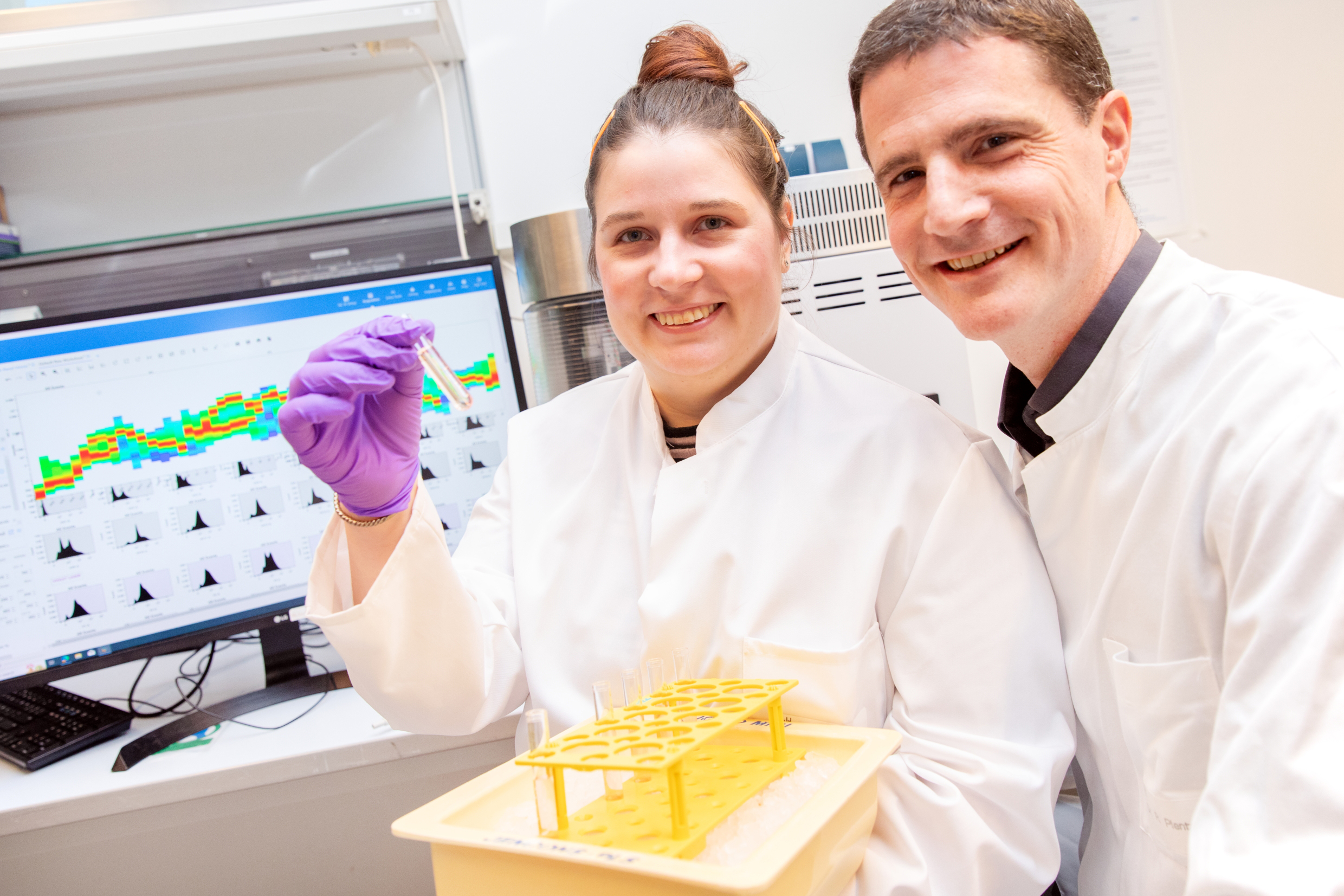 Sophie Anna Engelskircher and Dr Norman Woller are in the lab looking into the camera